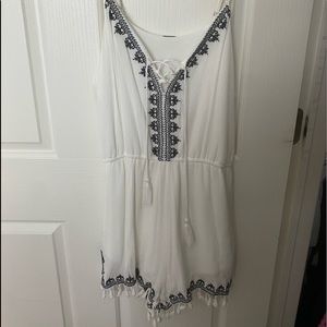 White and navy pattered romper with tassels